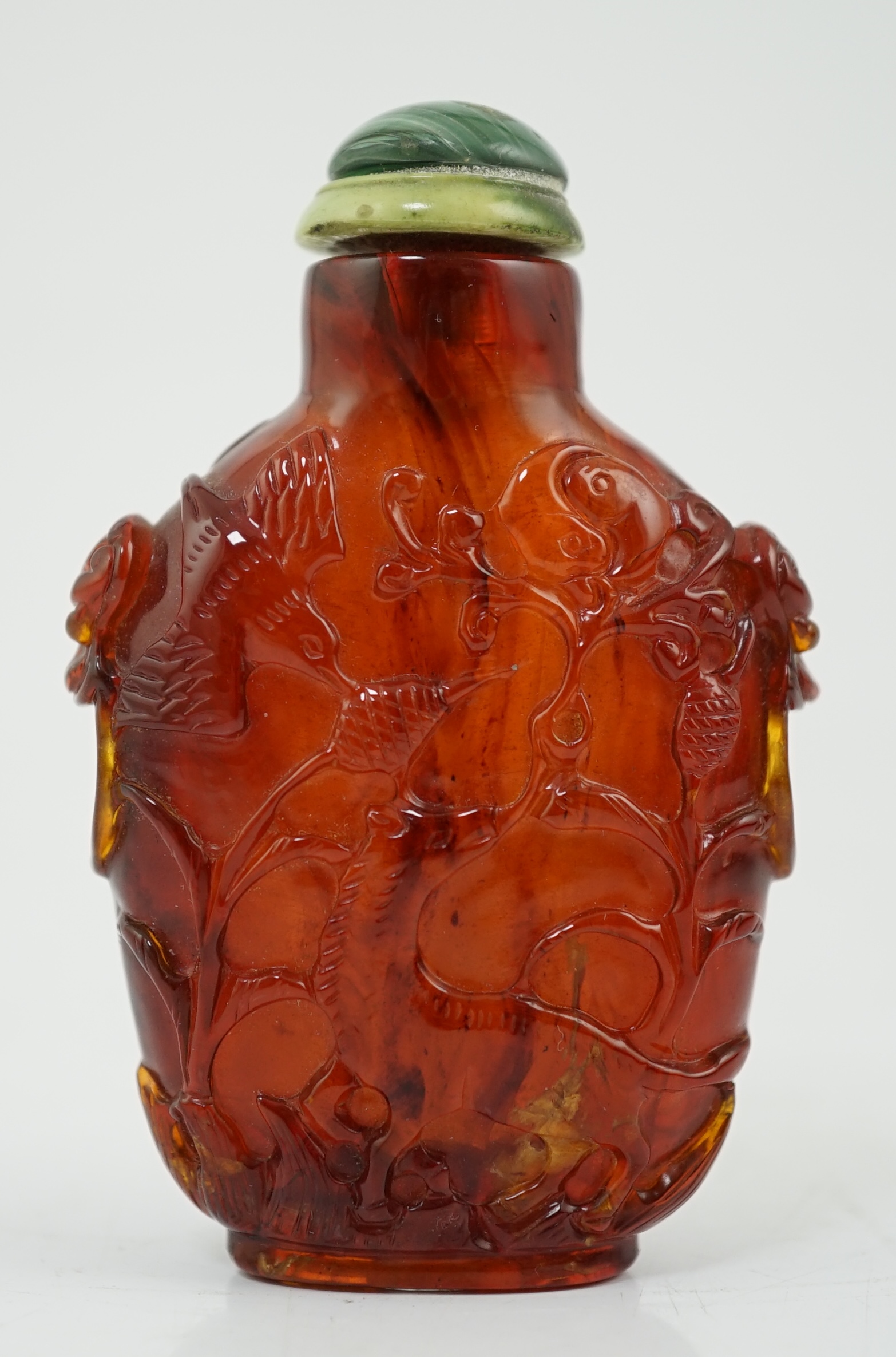 A Chinese carved amber snuff bottle, 19th century